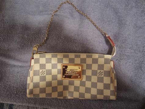 louis vuitton damier azur eva clutch replica|false louis vuitton stitches.